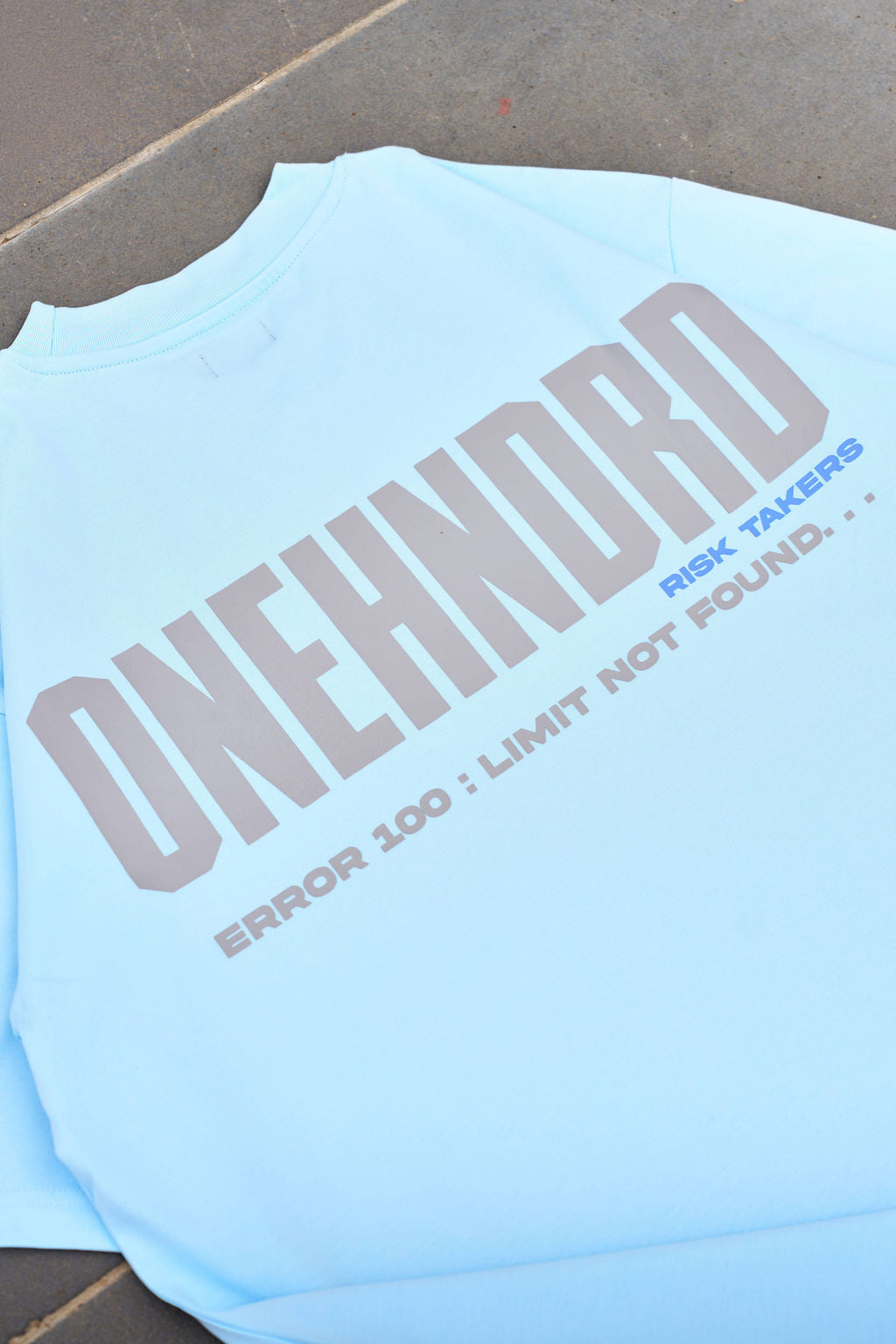 ONEHNDRD Risk Takers oversized tee sky blue unisex