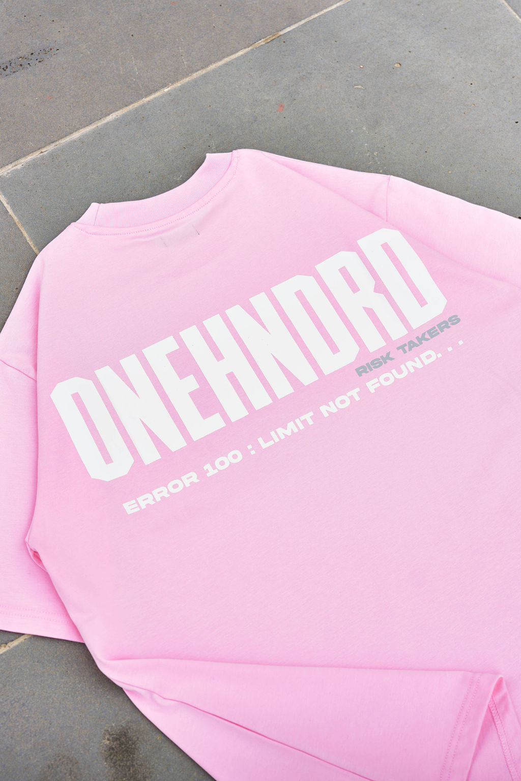 ONEHNDRD Risk Takers oversized tee dust pink unisex
